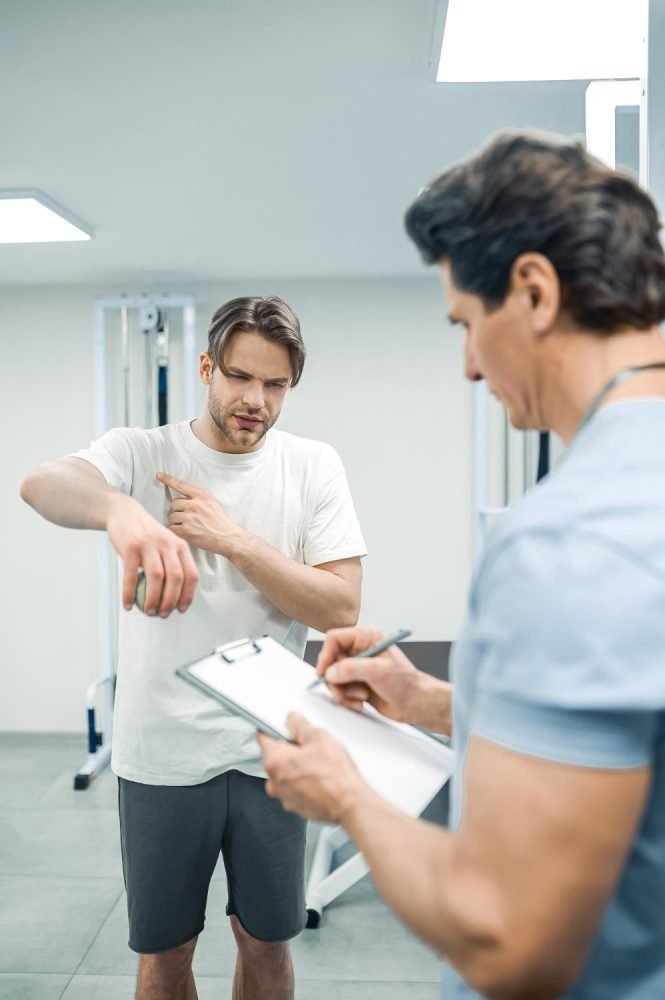 male patient have a physical therapy session in rehabilitation